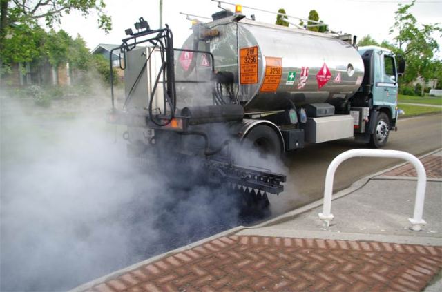 Laying bitumen, Shakespeare Street, Leamington, NZ
